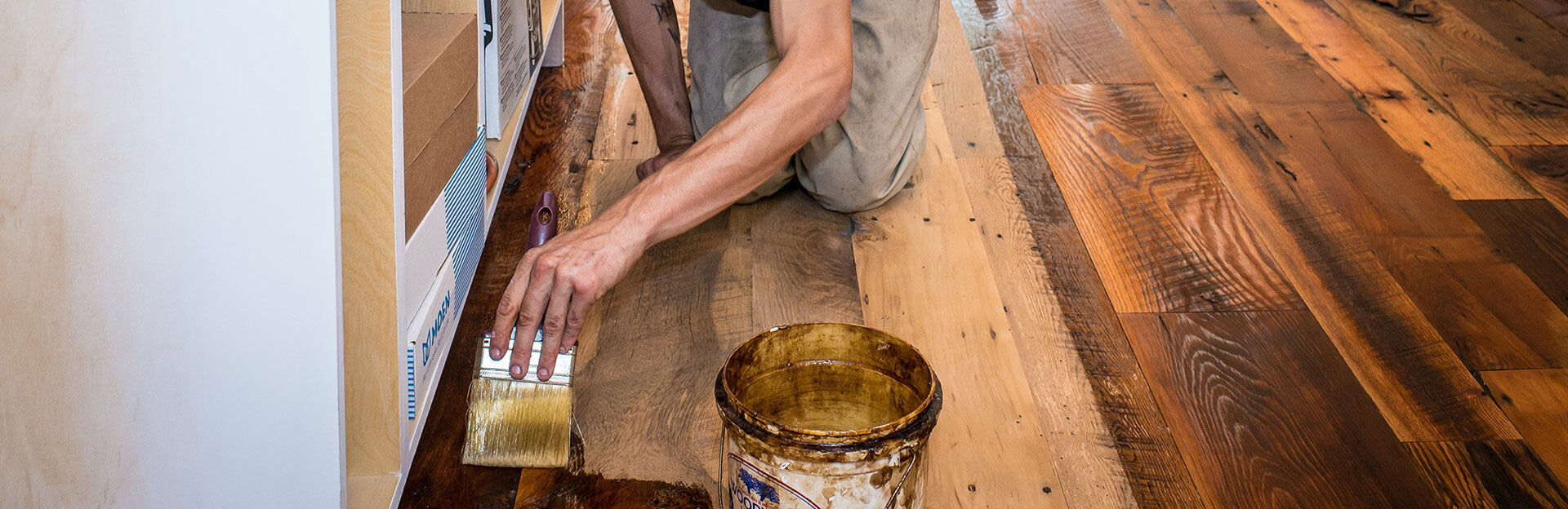 Applying finish on a freshly sanded wood floor