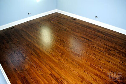 Dark Walnut stained bedroom wood floor