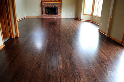 Installed, sanded and refinished floor stained Ebony and Sedona Red