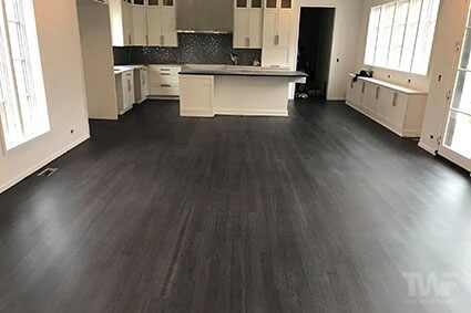 Dark colored hardwood floor in kitchen