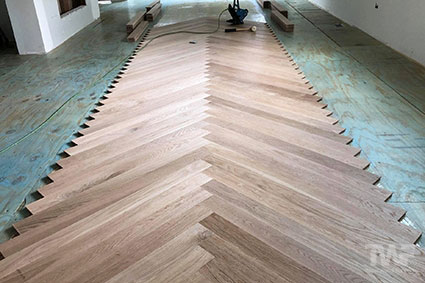 Glue down a new Herringbone wood floor