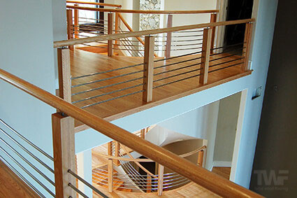 Sanded and refinished oak flooring and handrails